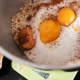 Mixing bowl full of egg yolks and other baking ingredients